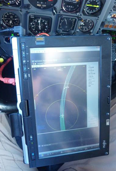 This is a pilot's eye view of the display from the Airborne Topographic Mapper developed by NASA's Wallops Flight Facility that allowed the DC-8 pilots to fly the exact route flown previously in earlier IceBridge missions, assuring that data collected can be compared to the previous years. Credit: NASA/Dick Ewers