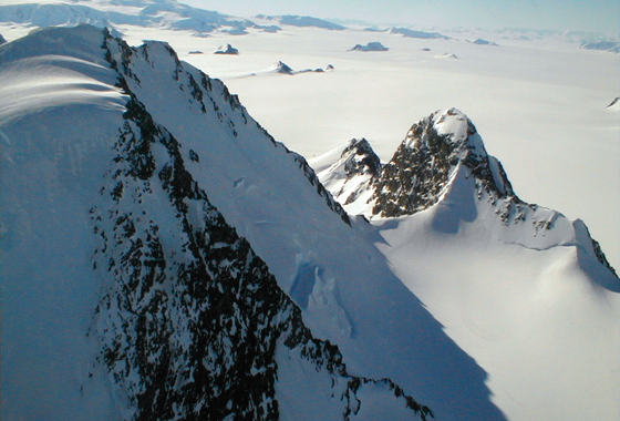 The frozen, inhospitable surface features of Alexander Island in Antarctica were viewed at close range during one of the final low-level flights by NASA's DC-8 flying laboratory during the 2011 Operation IceBridge mission. Credit: NASA/Chris Miller