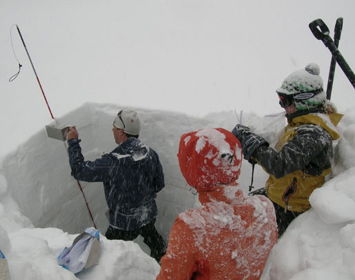 Taking snow samples as weather conditions worsen in the Colorado Mountains