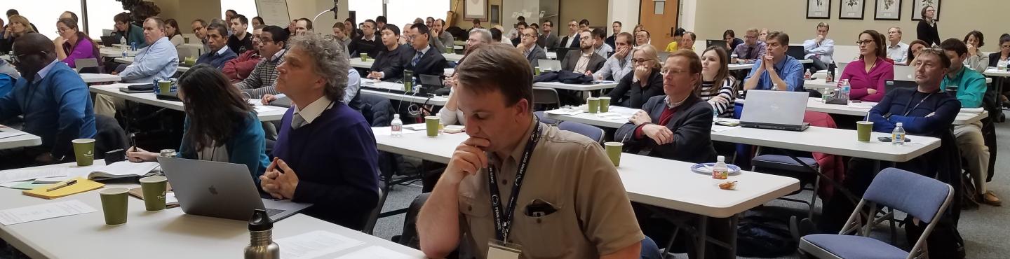 Photo of people sitting a workshop