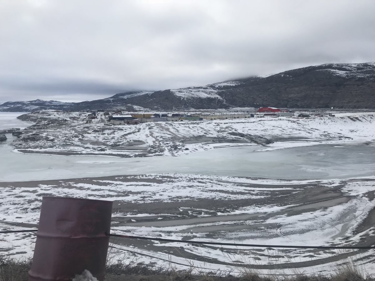 View of the Greenlandic town of Kanger from across a river.