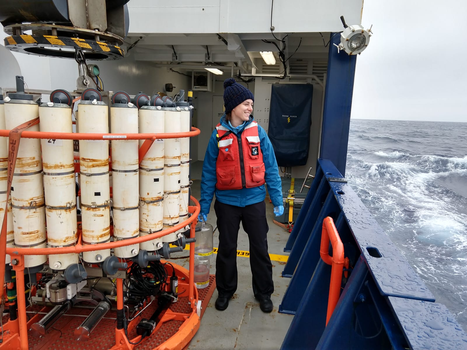 Alex Niebergall samples water from the morning optics cast.