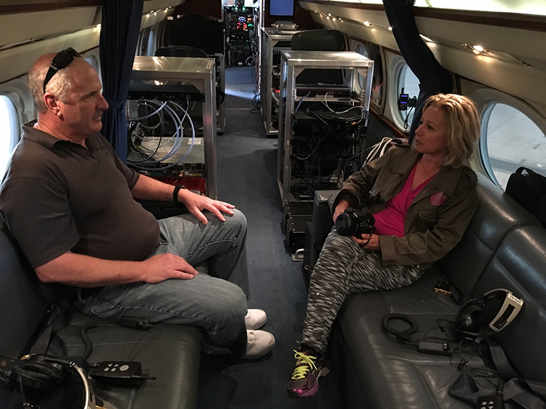 Project Manager Steve Dinardo and me aboard NASA’s modified G-III. A serious lack of champagne and caviar, but check out all that science equipment.