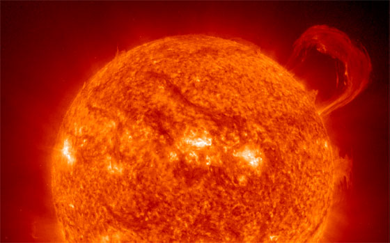 Extreme Ultraviolet Imaging telescope (EIT) image of the Sun with a huge, handle-shaped prominence, taken in 1999.